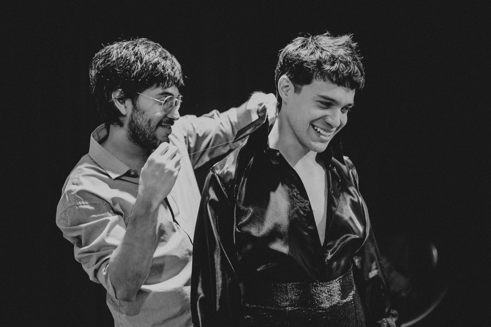 Carlos Molina dressing Alan Lez backstage in Atelier Molina, before going on stage