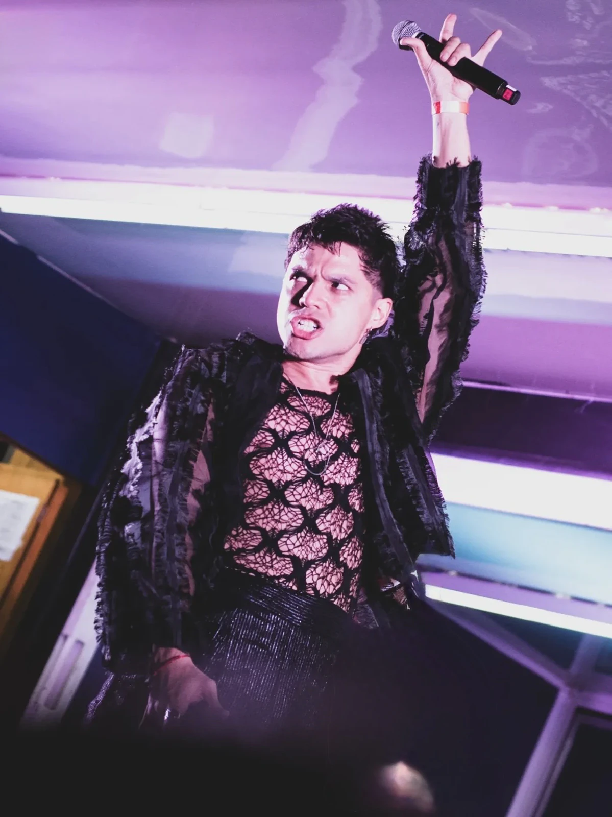 Alan Lez singing in the black lace and mesh outfit by Atelier Molina