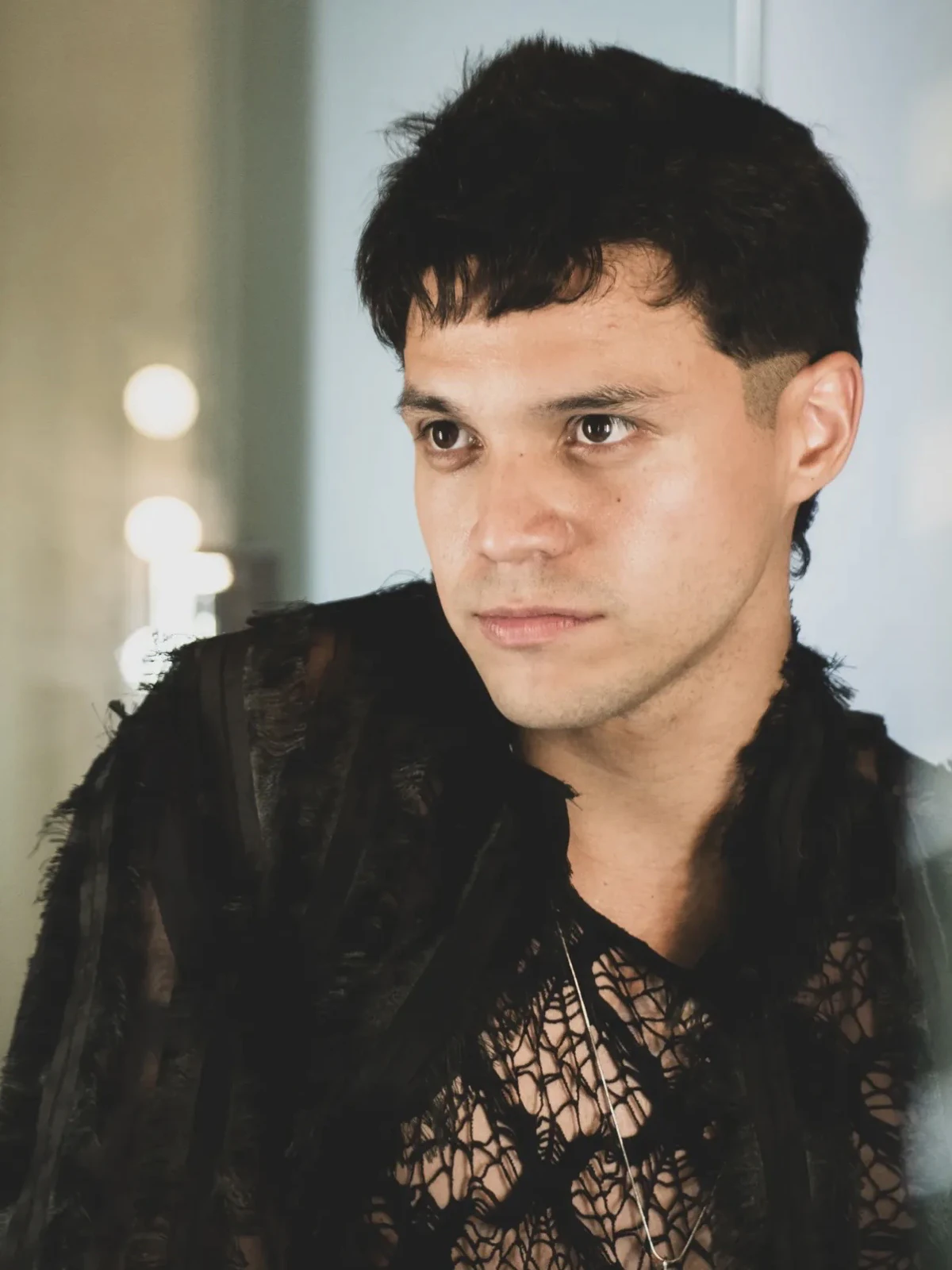 Portrait of Alan Lez in the frayed black lace jacket by Atelier Molina