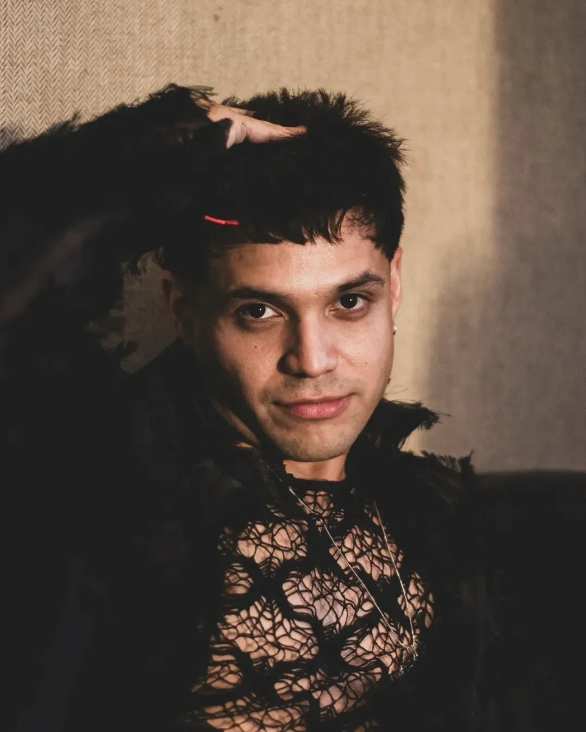 Alan Lez in the dressing room wearing the black lace outfit by Atelier Molina