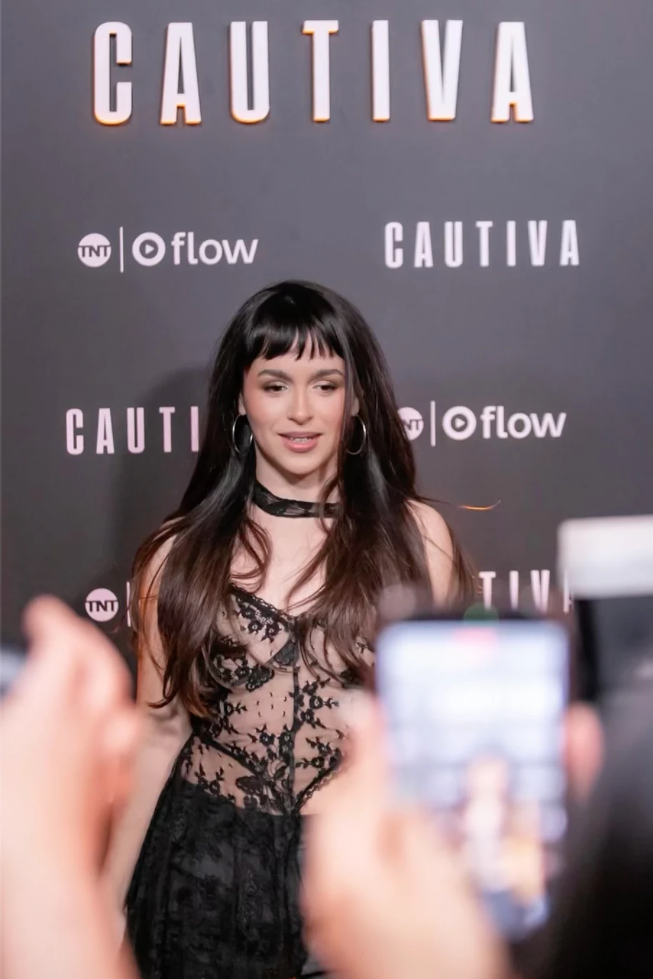 Evitta Luna facing the press at the Cautiva premiere in an Atelier Molina piece
