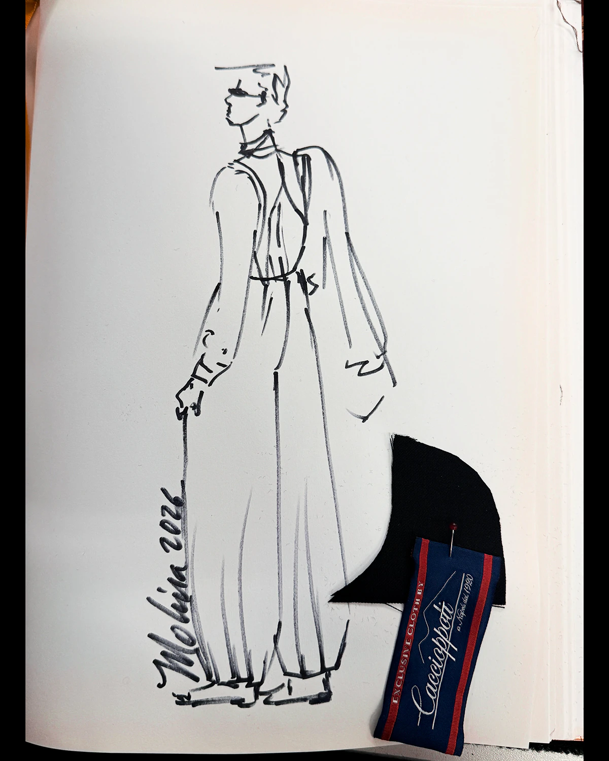 Signed sketch of Kevsho set beside the swatch of the wool used by Atelier Molina
