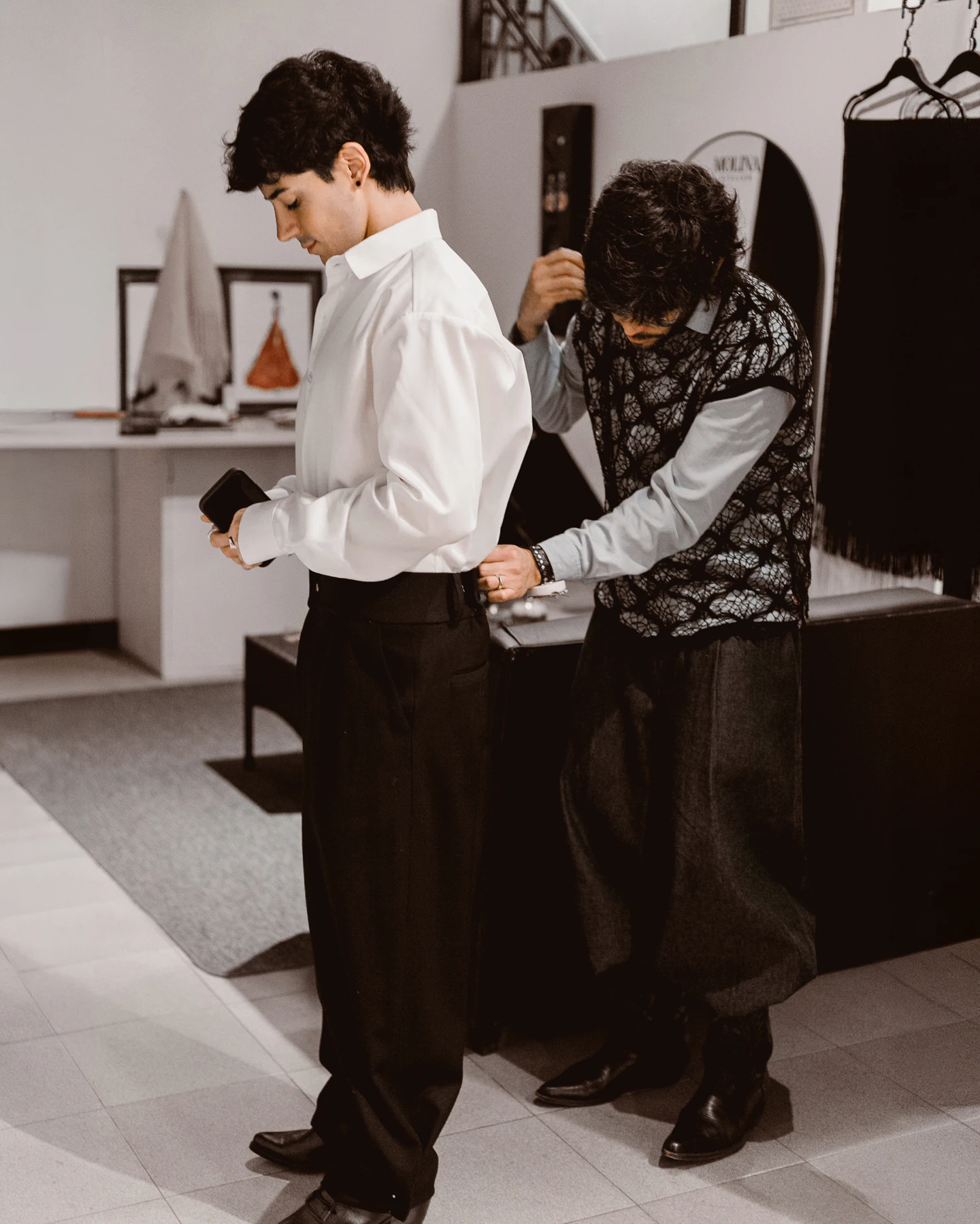 Adjusting the wide waistband of Kevsho tailored trouser at Atelier Molina